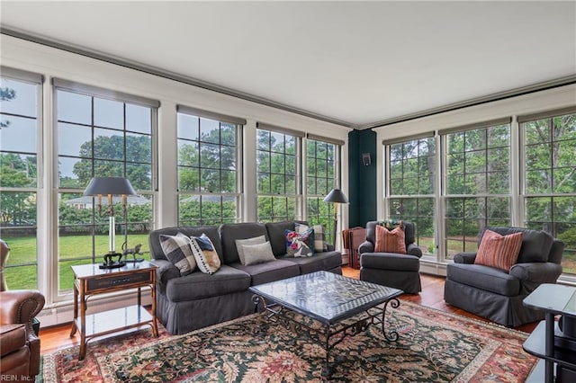 7320 Shirland Ave, Norfolk, VA 23505 - sunroom featuring wood finished floors, baseboard heating, and plenty of natural light