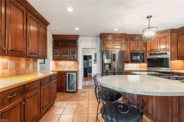 7320 Shirland Ave, Norfolk, VA 23505 - kitchen with appliances with stainless steel finishes, wine cooler, tasteful backsplash, light countertops, and recessed lighting