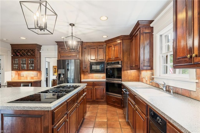 7320 Shirland Ave, Norfolk, VA 23505 - kitchen featuring black appliances, a sink, a chandelier, decorative backsplash, and recessed lighting