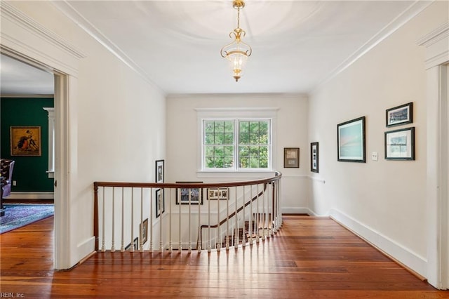 7320 Shirland Ave, Norfolk, VA 23505 - hallway with an upstairs landing, hardwood / wood-style floors, crown molding, baseboards, and a chandelier