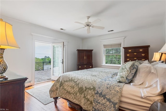 7320 Shirland Ave, Norfolk, VA 23505 - bedroom with access to outside, wood finished floors, a ceiling fan, a baseboard heating unit, and crown molding