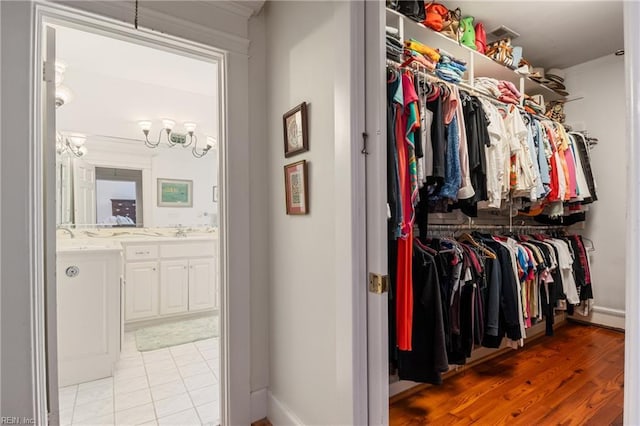 7320 Shirland Ave, Norfolk, VA 23505 - walk in closet featuring a sink and light wood-type flooring