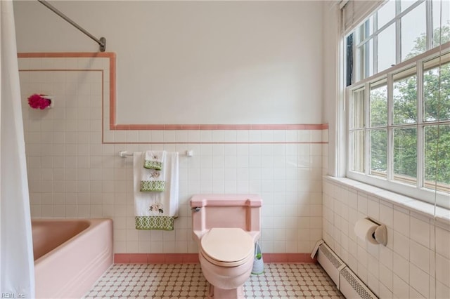 7320 Shirland Ave, Norfolk, VA 23505 - full bath featuring tile walls, toilet, tile patterned floors, a tub to relax in, and a wainscoted wall