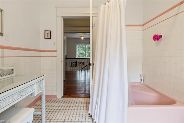 7320 Shirland Ave, Norfolk, VA 23505 - bathroom with tile walls, shower / tub combo, tile patterned floors, a wainscoted wall, and toilet