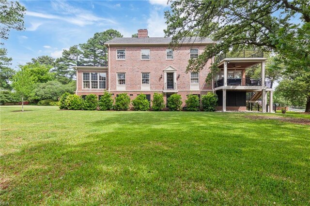 7320 Shirland Ave, Norfolk, VA 23505 - rear view of property with a chimney, a lawn, brick siding, and a balcony