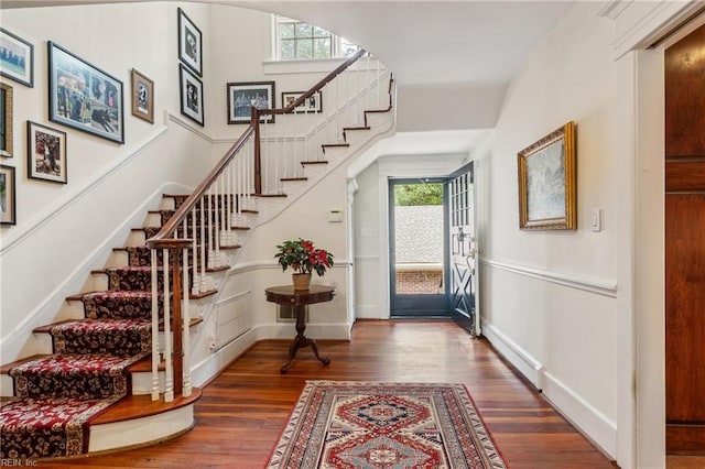 7320 Shirland Ave, Norfolk, VA 23505 - entrance foyer with stairway, healthy amount of natural light, wood finished floors, and baseboards