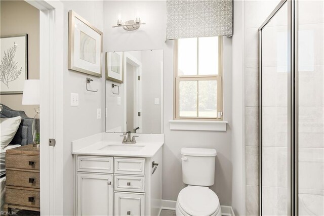 1129 Egret Ln, Suffolk, VA 23434 - full bathroom featuring a tile shower, toilet, vanity, and baseboards