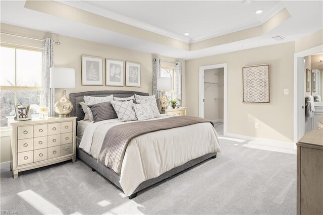 1129 Egret Ln, Suffolk, VA 23434 - bedroom with light carpet, a tray ceiling, baseboards, a spacious closet, and ornamental molding