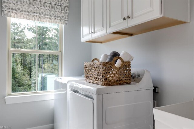 1129 Egret Ln, Suffolk, VA 23434 - laundry room featuring cabinet space and washing machine and dryer
