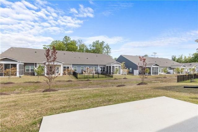 view of green lawn featuring a patio area and a residential view