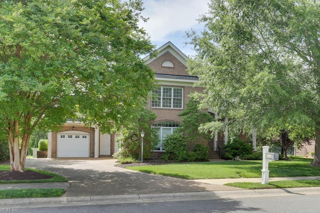 321 Tindalls Ct, Suffolk, VA 23436 - obstructed view of property with brick siding, a front lawn, and driveway