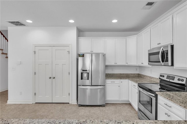 208 Mayberry Ct, Newport News, VA 23601 - kitchen with appliances with stainless steel finishes, white cabinets, light stone countertops, recessed lighting, and baseboards