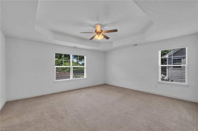 208 Mayberry Ct, Newport News, VA 23601 - spare room featuring a tray ceiling, plenty of natural light, a ceiling fan, carpet flooring, and ornamental molding