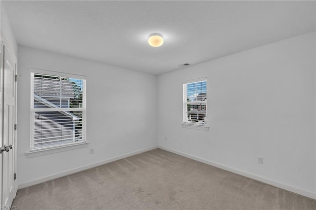 208 Mayberry Ct, Newport News, VA 23601 - empty room featuring light colored carpet, baseboards, and a textured ceiling
