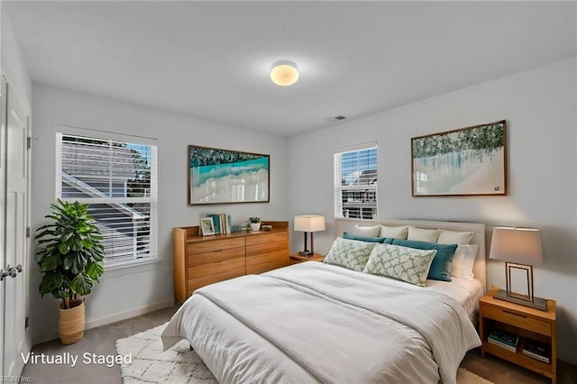 208 Mayberry Ct, Newport News, VA 23601 - carpeted bedroom featuring multiple windows and baseboards