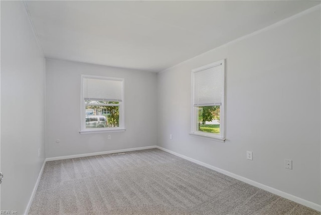708 Harway Ave, Chesapeake, VA 23325 - spare room featuring healthy amount of natural light, carpet flooring, and baseboards