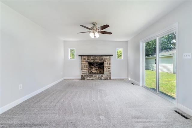 708 Harway Ave, Chesapeake, VA 23325 - unfurnished living room featuring ceiling fan, baseboards, carpet, and a stone fireplace