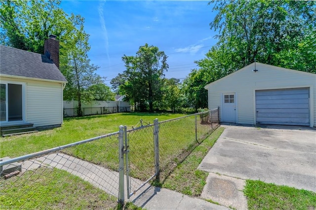 708 Harway Ave, Chesapeake, VA 23325 - view of yard with driveway, a detached garage, and an outbuilding