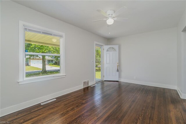 708 Harway Ave, Chesapeake, VA 23325 - unfurnished room featuring healthy amount of natural light, baseboards, dark wood finished floors, and ceiling fan