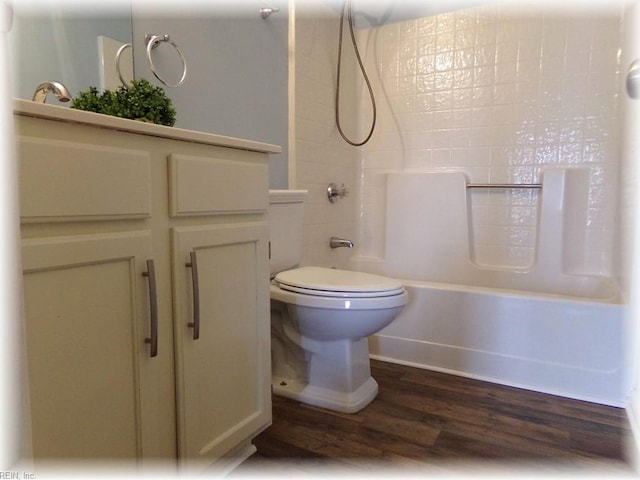 1563 N King St Unit 110, Hampton, VA 23669 - bathroom featuring wood finished floors, vanity, shower / tub combination, toilet, and baseboards