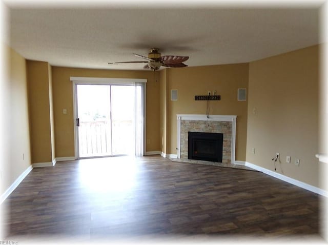 1563 N King St Unit 110, Hampton, VA 23669 - unfurnished living room with dark wood-style floors, ceiling fan, a fireplace, and baseboards
