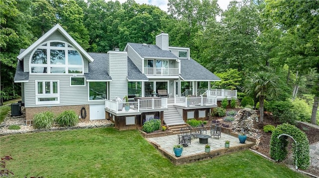 103 Acacia Ct, Williamsburg, VA 23185 - back of house featuring a balcony, a patio area, a lawn, and a shingled roof