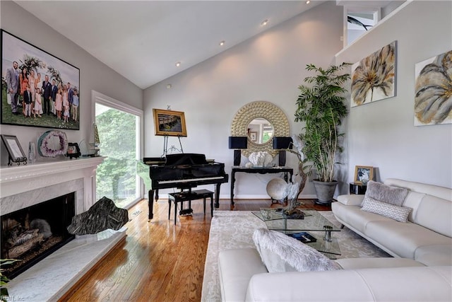 103 Acacia Ct, Williamsburg, VA 23185 - living area featuring high vaulted ceiling, wood finished floors, a high end fireplace, and recessed lighting
