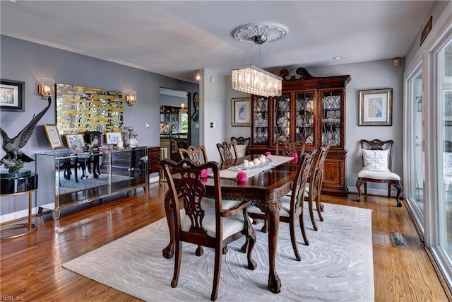103 Acacia Ct, Williamsburg, VA 23185 - dining room featuring wood finished floors and a chandelier