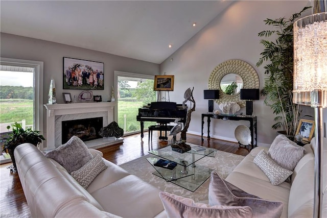 103 Acacia Ct, Williamsburg, VA 23185 - living room with a fireplace, wood finished floors, baseboards, recessed lighting, and high vaulted ceiling