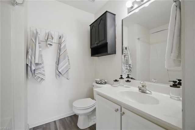 610 Barberton Dr, Virginia Beach, VA 23451 - full bath with wood finished floors, toilet, vanity, baseboards, and a shower