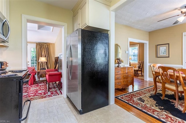 200 Ferguson Ave, Newport News, VA 23601 - kitchen with appliances with stainless steel finishes, a ceiling fan, and cream cabinetry