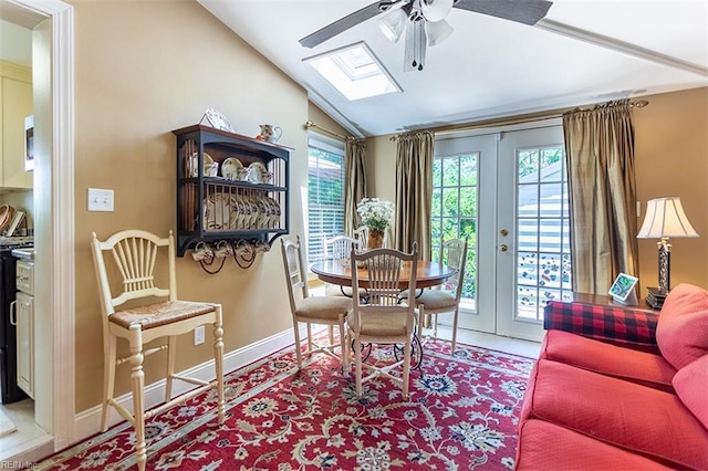 200 Ferguson Ave, Newport News, VA 23601 - dining space featuring lofted ceiling, ceiling fan, a skylight, baseboards, and french doors