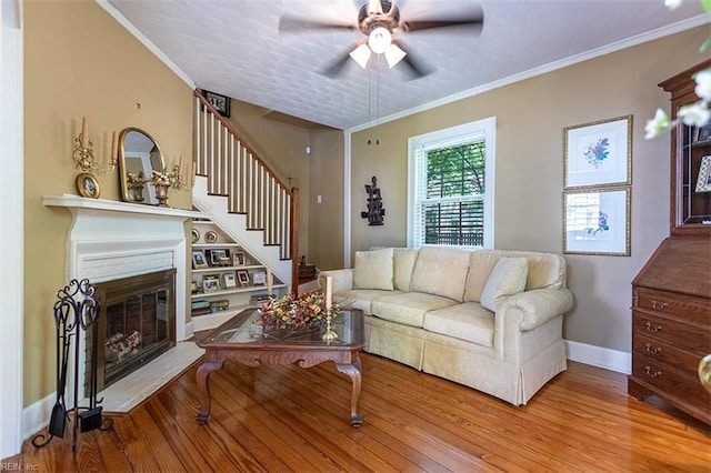 200 Ferguson Ave, Newport News, VA 23601 - living room with ceiling fan, wood finished floors, stairway, a glass covered fireplace, and baseboards