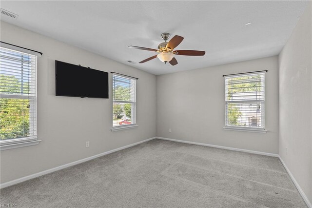 3001 Ravine Gap Dr, Suffolk, VA 23434 - unfurnished room featuring plenty of natural light, ceiling fan, and carpet