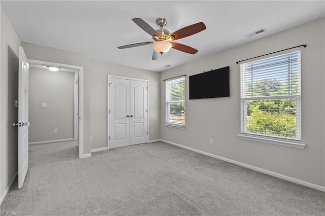 3001 Ravine Gap Dr, Suffolk, VA 23434 - unfurnished bedroom featuring carpet floors, baseboards, a closet, and a ceiling fan