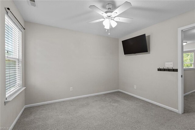 3001 Ravine Gap Dr, Suffolk, VA 23434 - spare room featuring carpet, ceiling fan, and baseboards