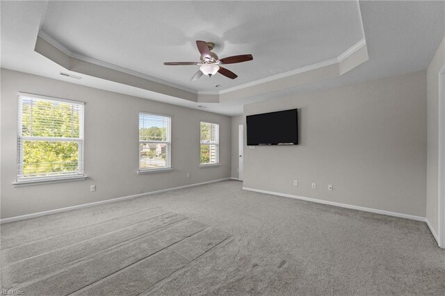 3001 Ravine Gap Dr, Suffolk, VA 23434 - carpeted empty room featuring a raised ceiling, ornamental molding, ceiling fan, and baseboards