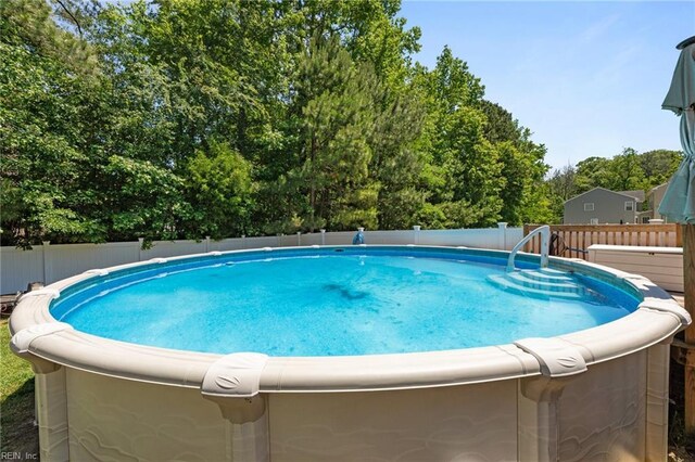 3001 Ravine Gap Dr, Suffolk, VA 23434 - view of swimming pool with a deck and view of scattered trees