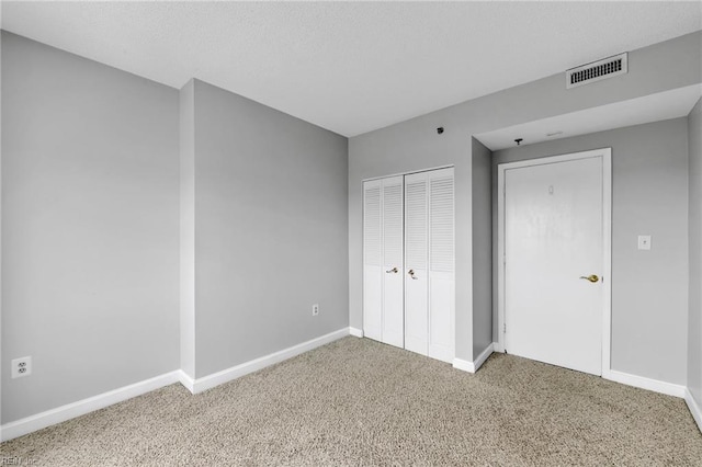 3556 Shore Dr Unit 704, Virginia Beach, VA 23455 - unfurnished bedroom featuring carpet floors, baseboards, and a closet