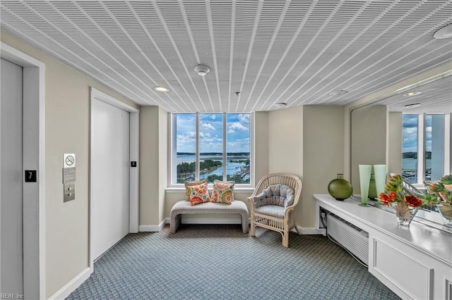 3556 Shore Dr Unit 704, Virginia Beach, VA 23455 - living area featuring carpet, elevator, baseboards, recessed lighting, and a water view