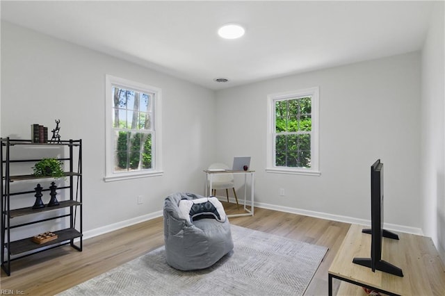 4009 Forresthills Dr, Portsmouth, VA 23703 - sitting room with plenty of natural light, wood finished floors, and baseboards