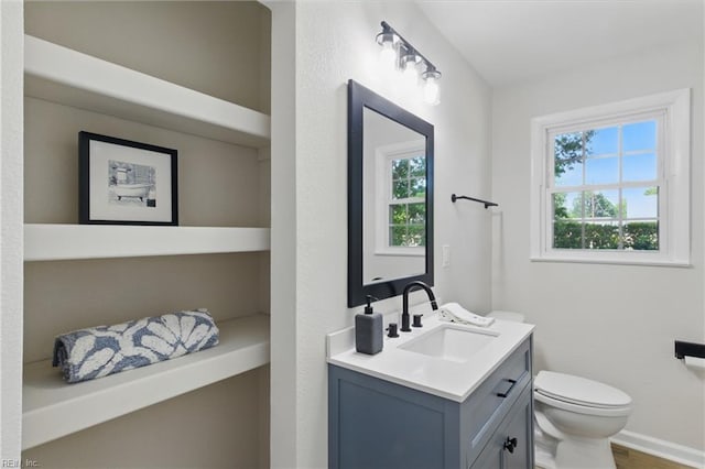 4009 Forresthills Dr, Portsmouth, VA 23703 - bathroom with toilet, healthy amount of natural light, vanity, and wood finished floors