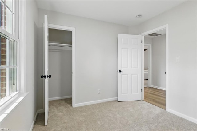 4009 Forresthills Dr, Portsmouth, VA 23703 - unfurnished bedroom featuring light colored carpet, a closet, and baseboards