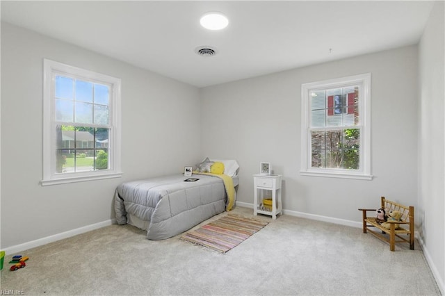 4009 Forresthills Dr, Portsmouth, VA 23703 - bedroom featuring multiple windows, carpet flooring, and baseboards