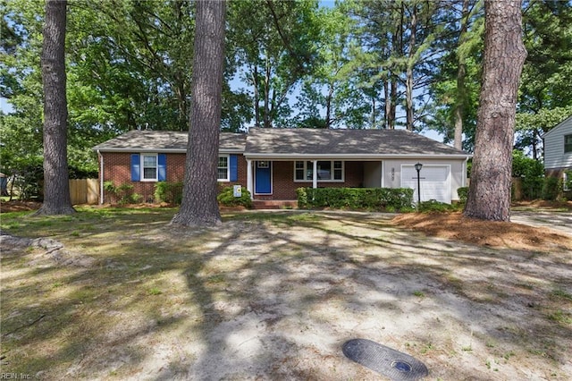 4009 Forresthills Dr, Portsmouth, VA 23703 - ranch-style house featuring an attached garage, covered porch, brick siding, and driveway