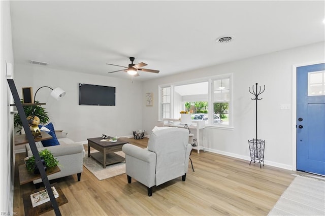 4009 Forresthills Dr, Portsmouth, VA 23703 - living room with light wood-type flooring, ceiling fan, and baseboards