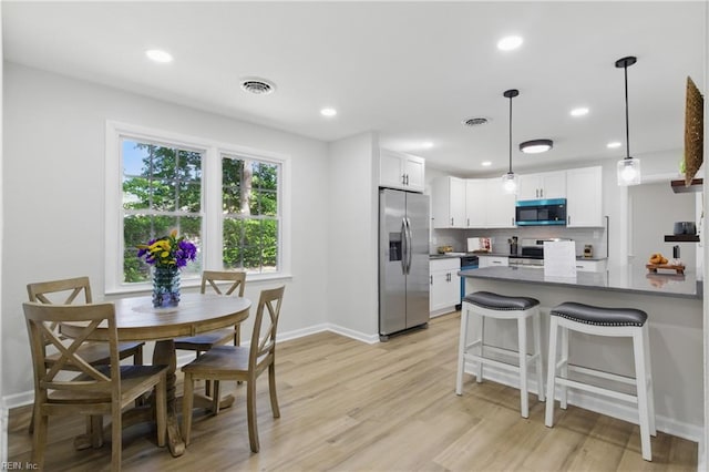 4009 Forresthills Dr, Portsmouth, VA 23703 - dining room with light wood-style floors, baseboards, and recessed lighting