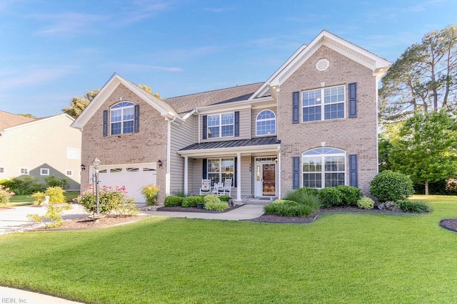 traditional-style home featuring brick siding, a front lawn, a standing seam roof, a garage, and concrete driveway