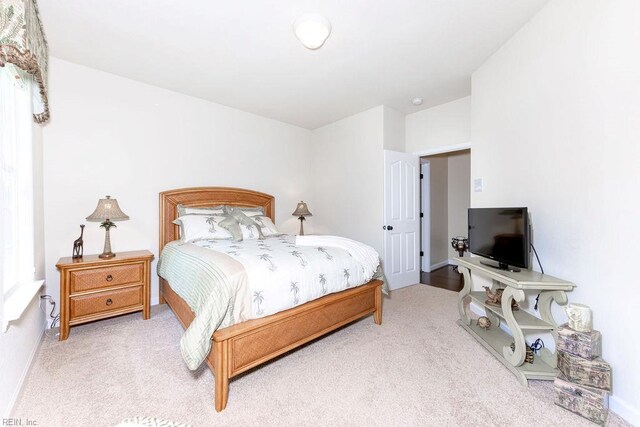carpeted bedroom with baseboards