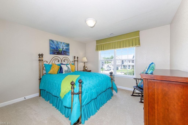 bedroom featuring carpet flooring and baseboards